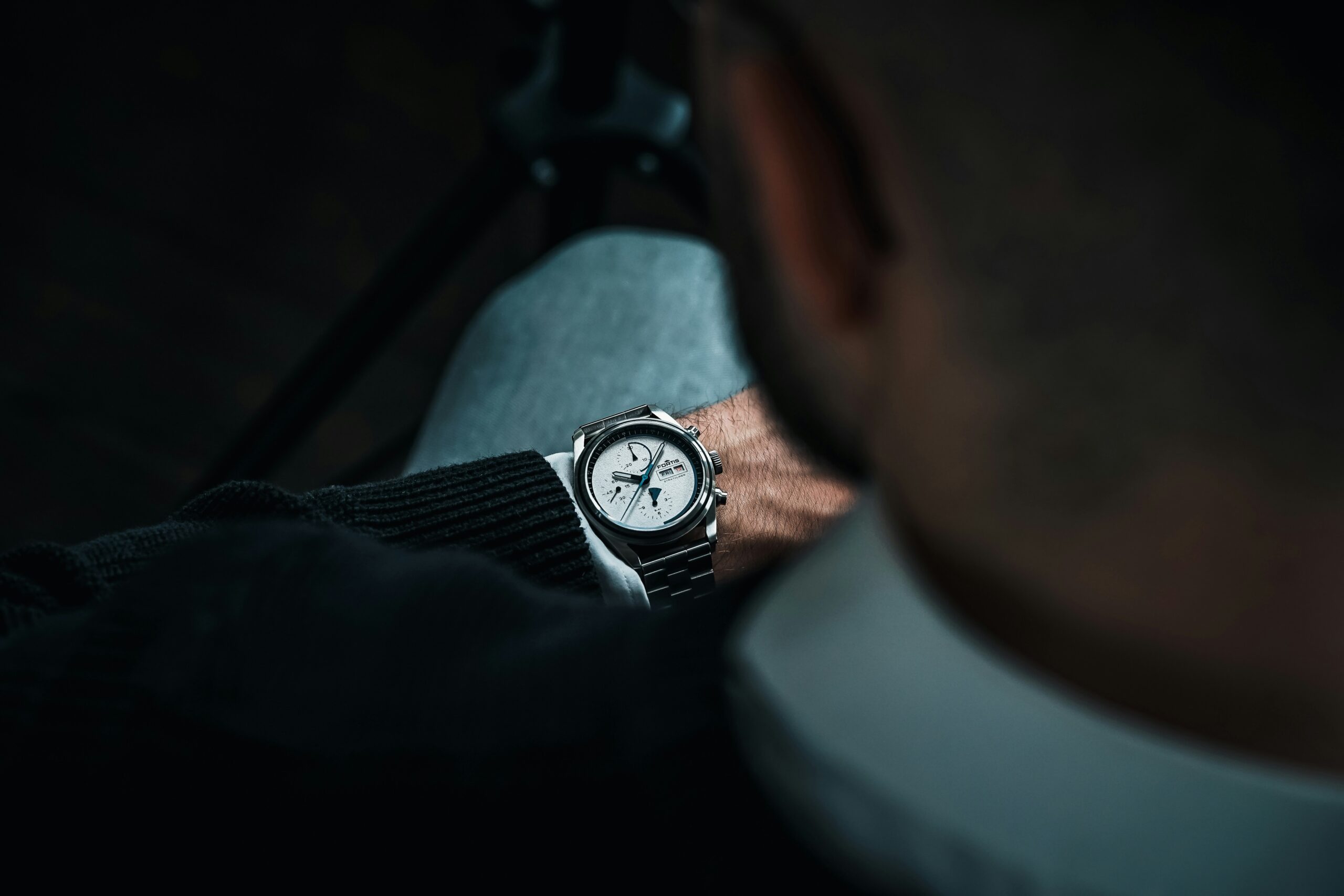 a man with a watch on his wrist